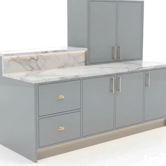 Assembled grey kitchen with marble top and brass handles.