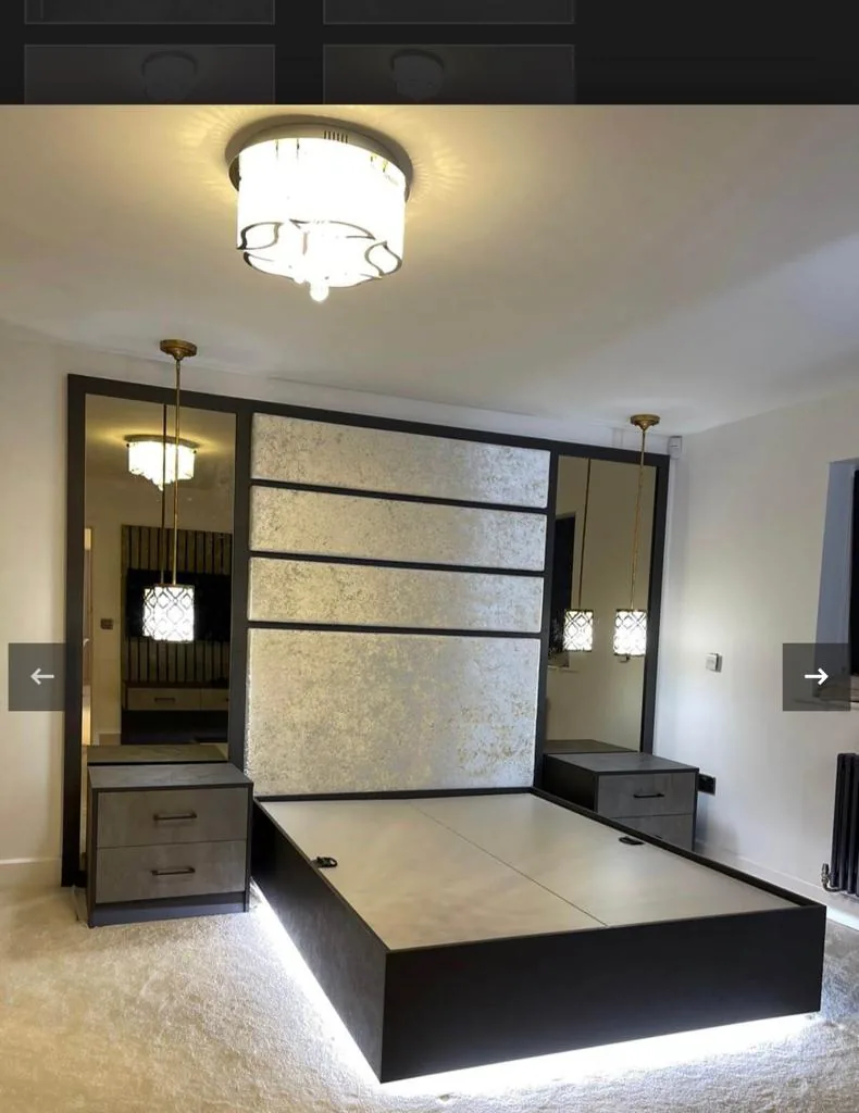 Black crackle-finish headboard wall · LED plinth · pendant lighting