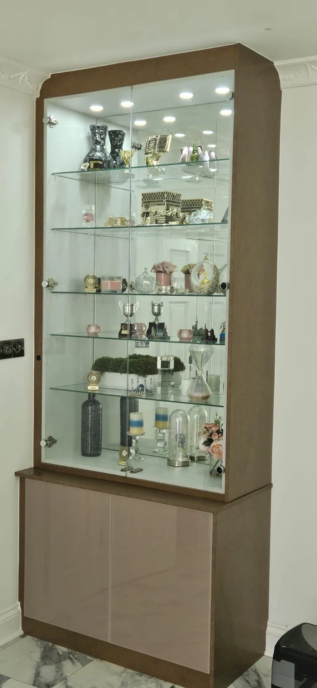 Illuminated display cabinet · glass shelves · beige frame