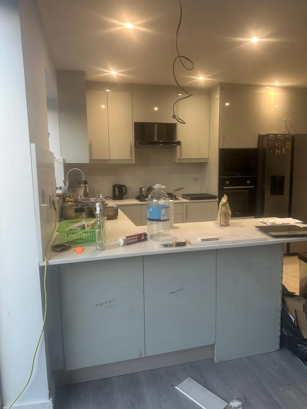 Cream gloss kitchen · white worktop