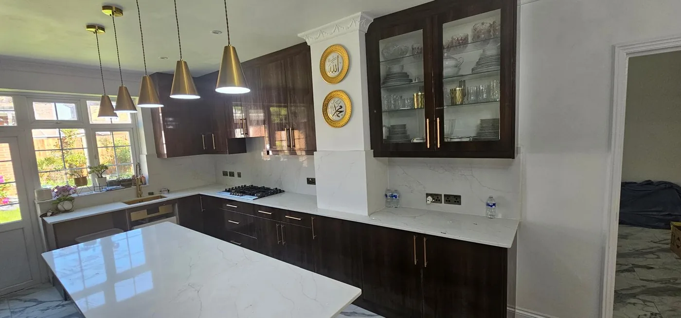 Walnut kitchen · marble backsplash · glass display cabinet