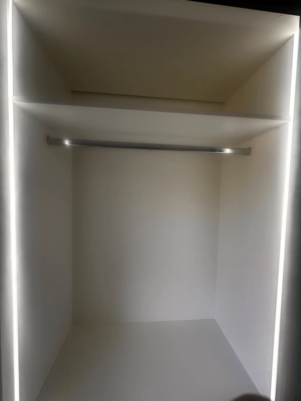 Empty wardrobe interior · LED edge lighting & hanging rail