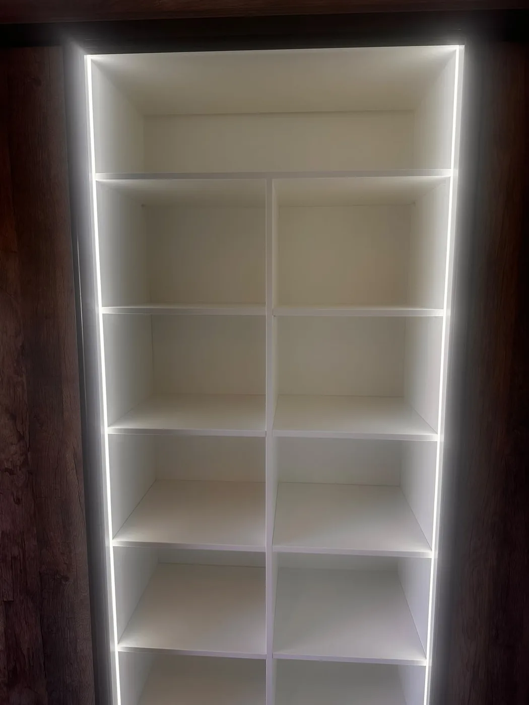 Open cube shelving · LED edge strip · walnut frame