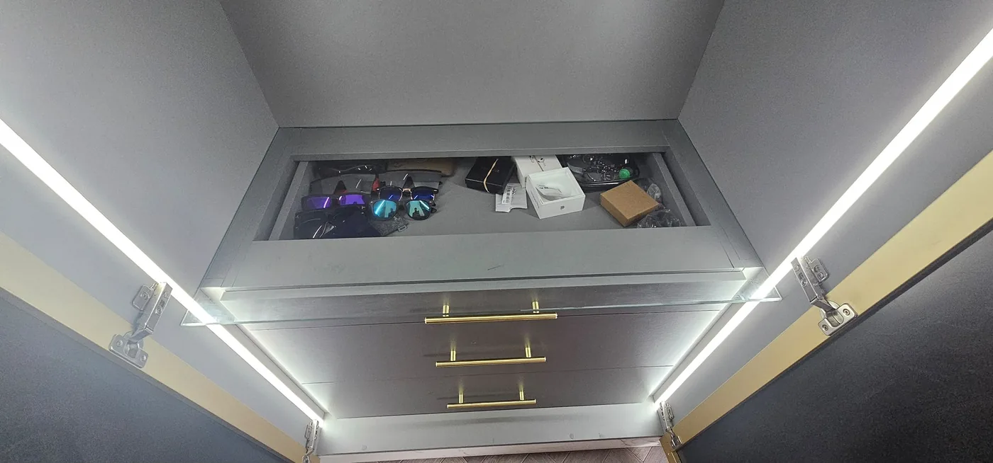 Pull-down LED shelf · brass handles