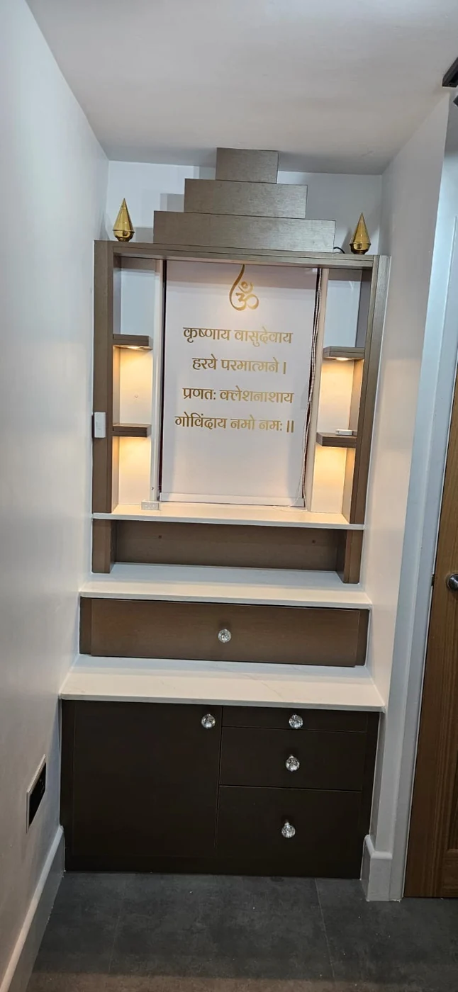 Bespoke mandir · gold Sanskrit script · stepped canopy