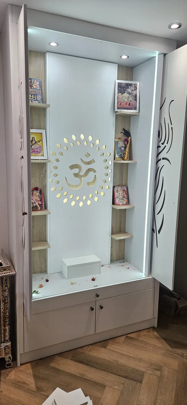 Fitted mandir alcove · backlit gold Om · glass shelving