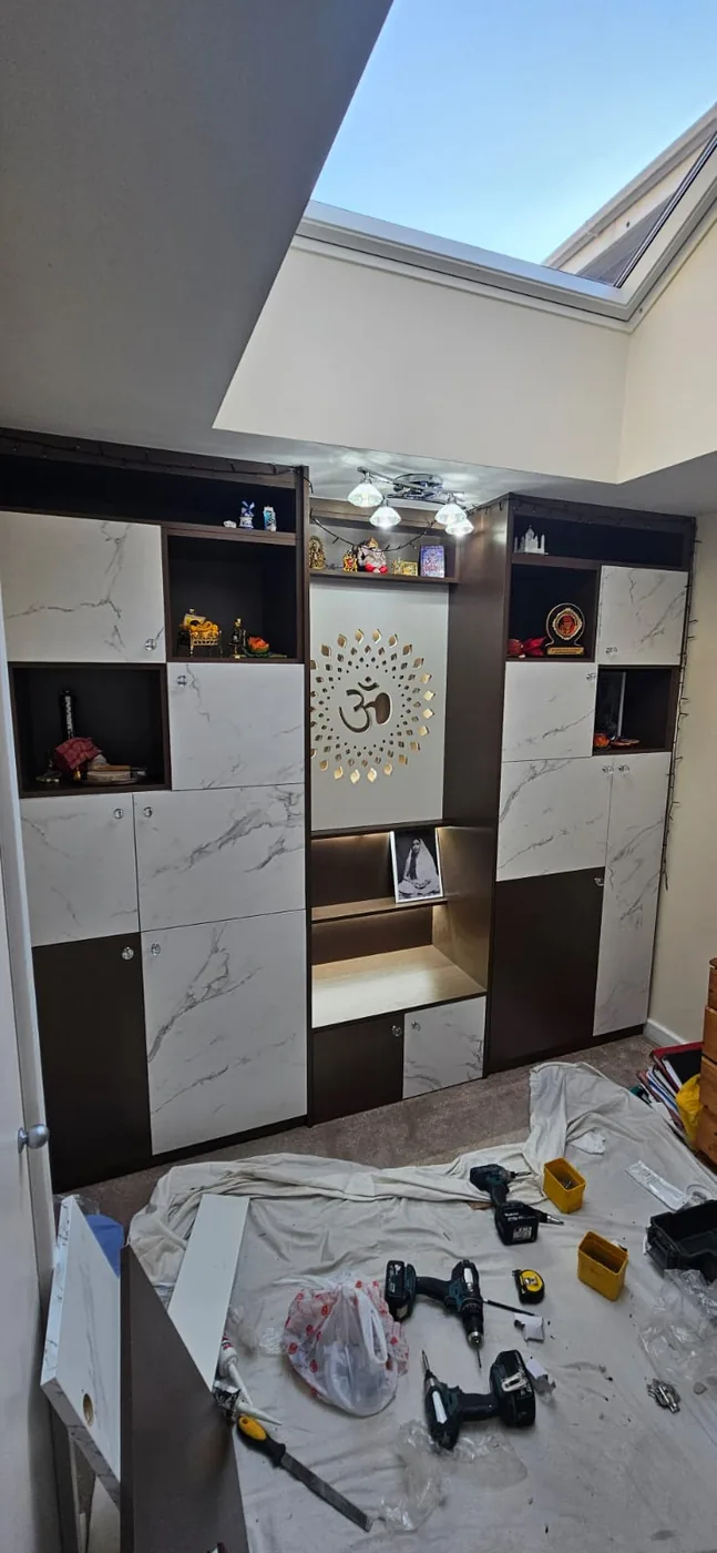 Marble-effect fitted mandir · backlit Om medallion