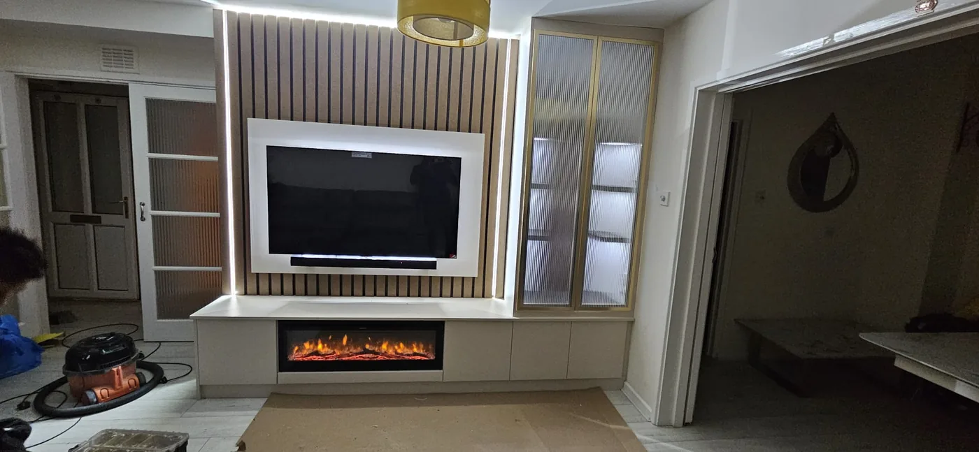 Cream & gold panelled media wall · fluted glass display cabinet