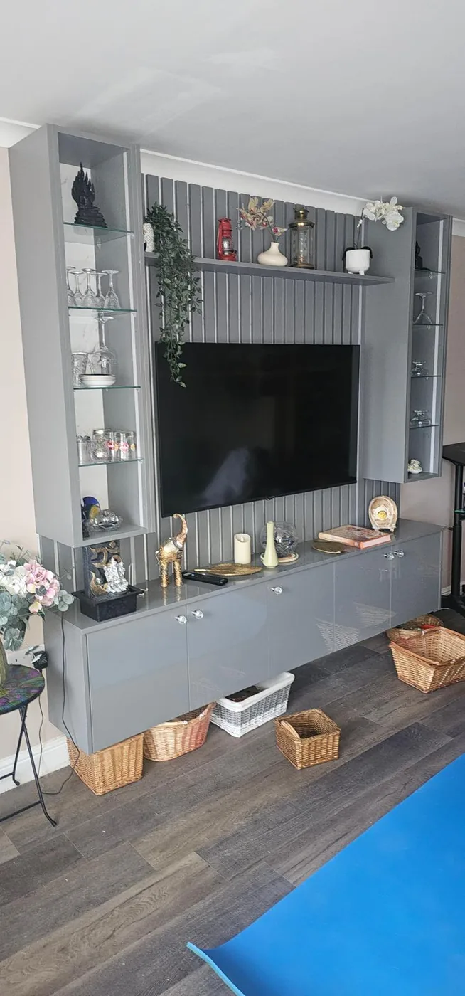 Grey gloss floating media unit · glass display towers