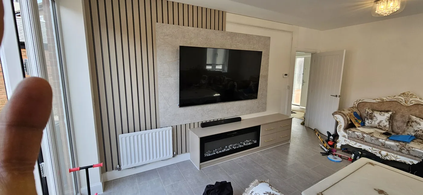 Oak slat media wall · marble-effect TV surround