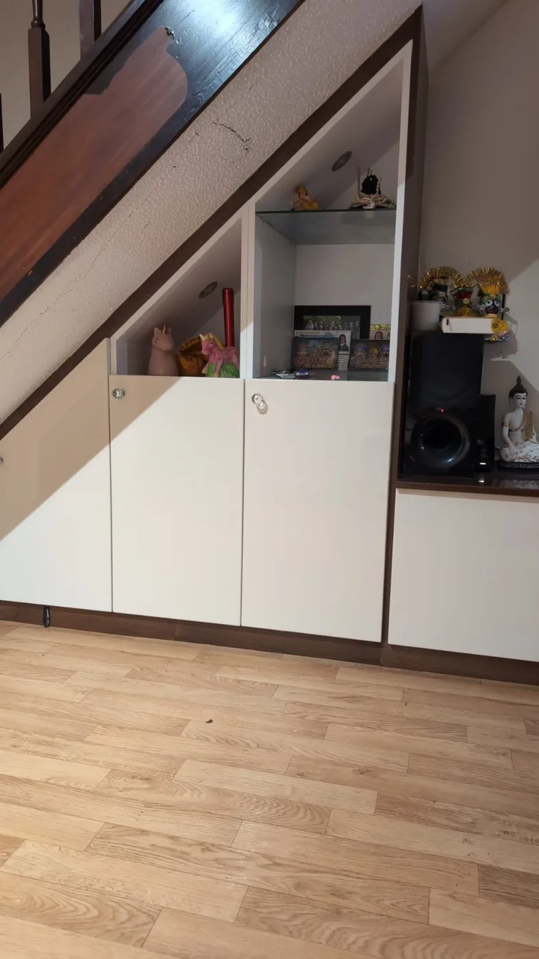 Under-stair display shelf & storage cupboards