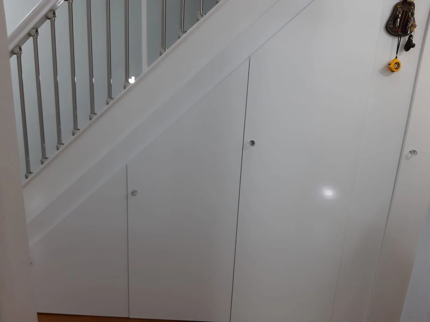 White gloss under-stair storage cupboards