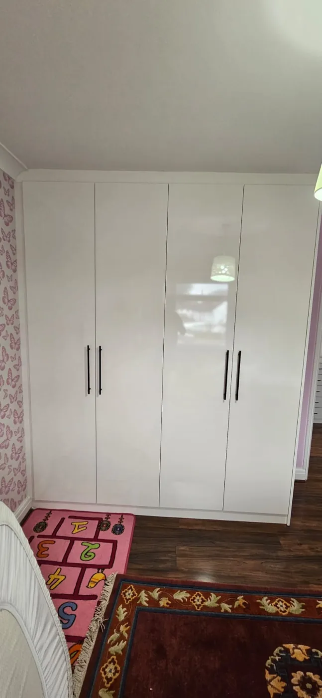 White gloss wardrobe · black handles