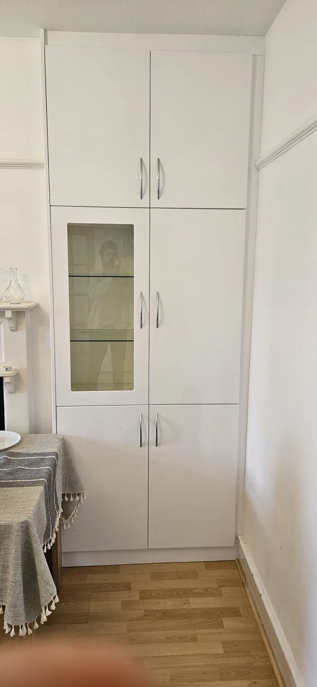 White fitted tower · glass display panel · chrome handles