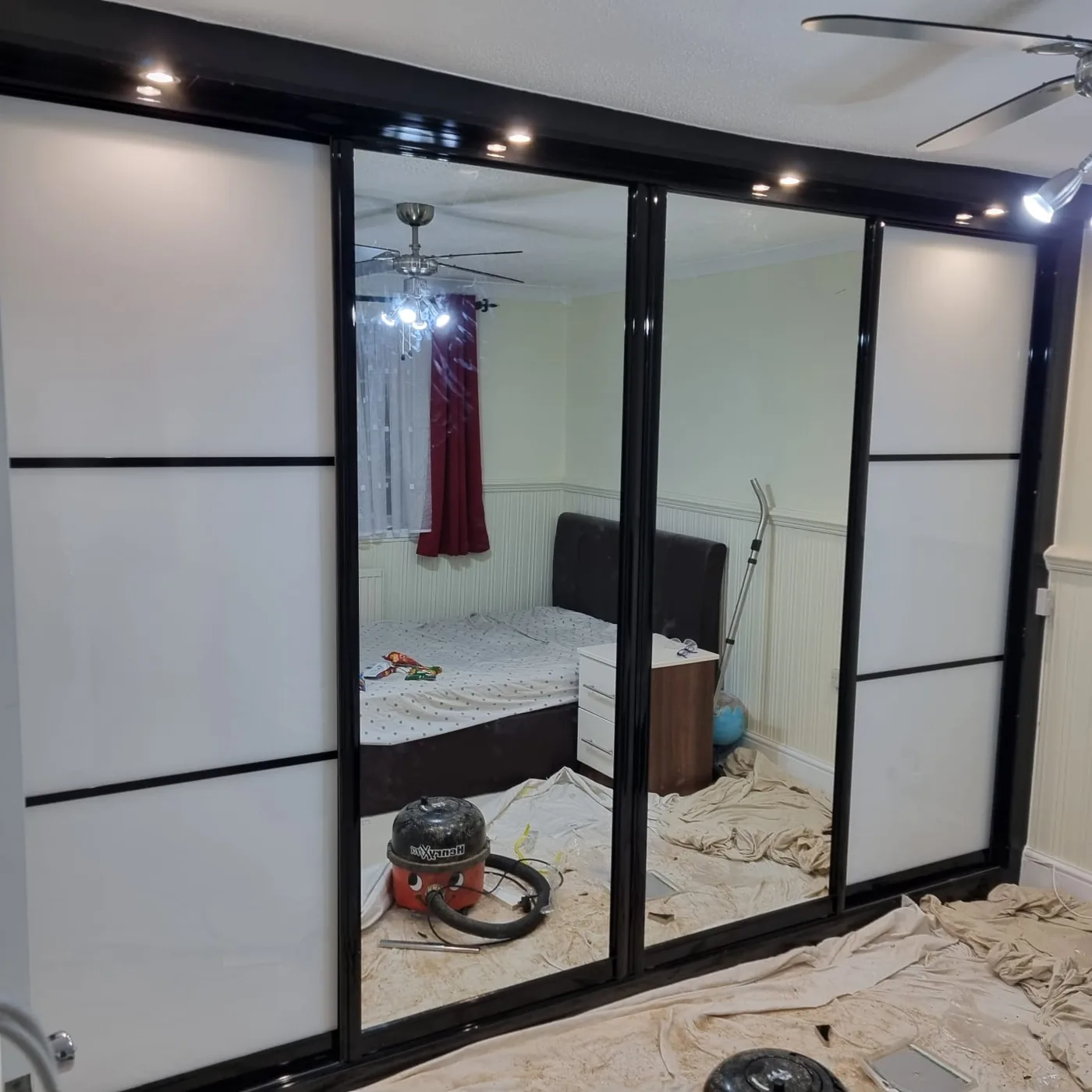 Mushroom & mirror sliding wardrobe · bronze frame