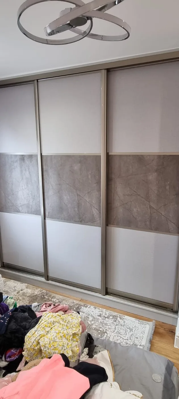 Mirrored sliding wardrobe · black frame