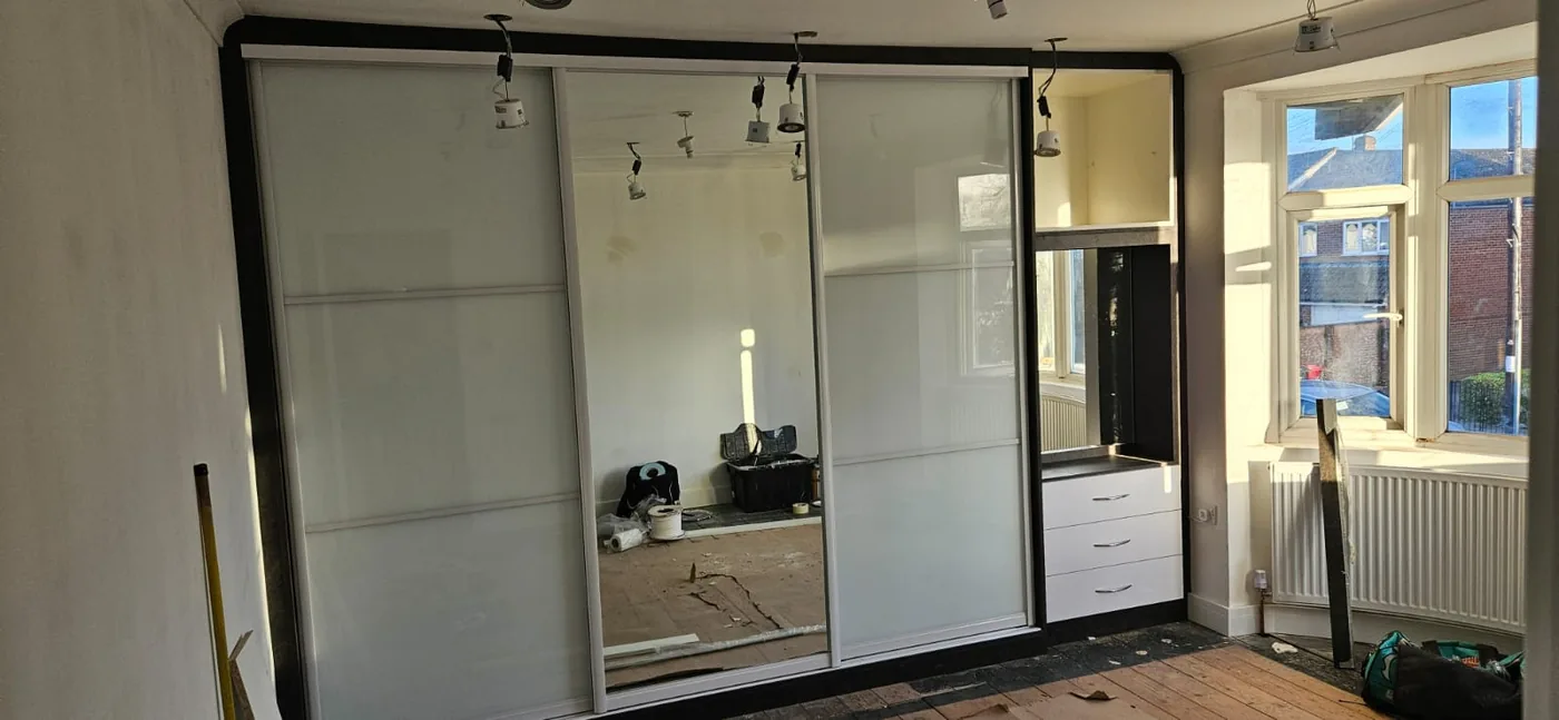 White frosted sliding wardrobe · matching dressing table