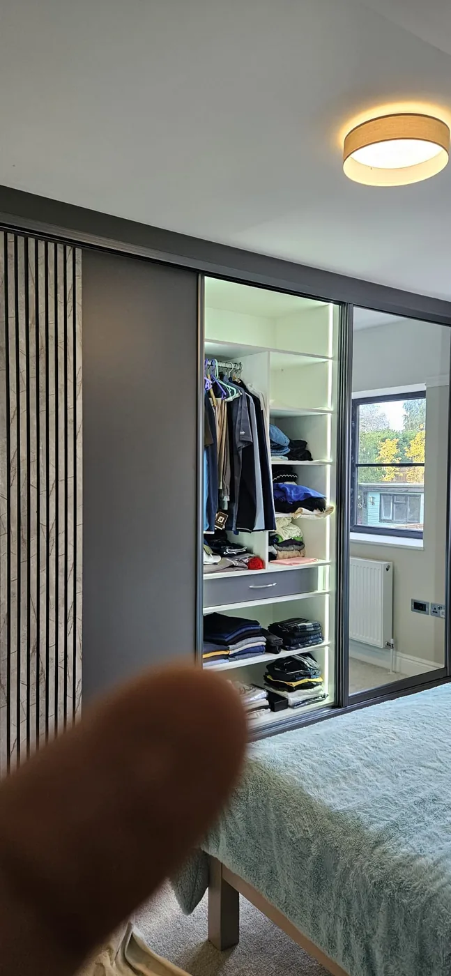 Sliding wardrobe · open LED-lit interior storage