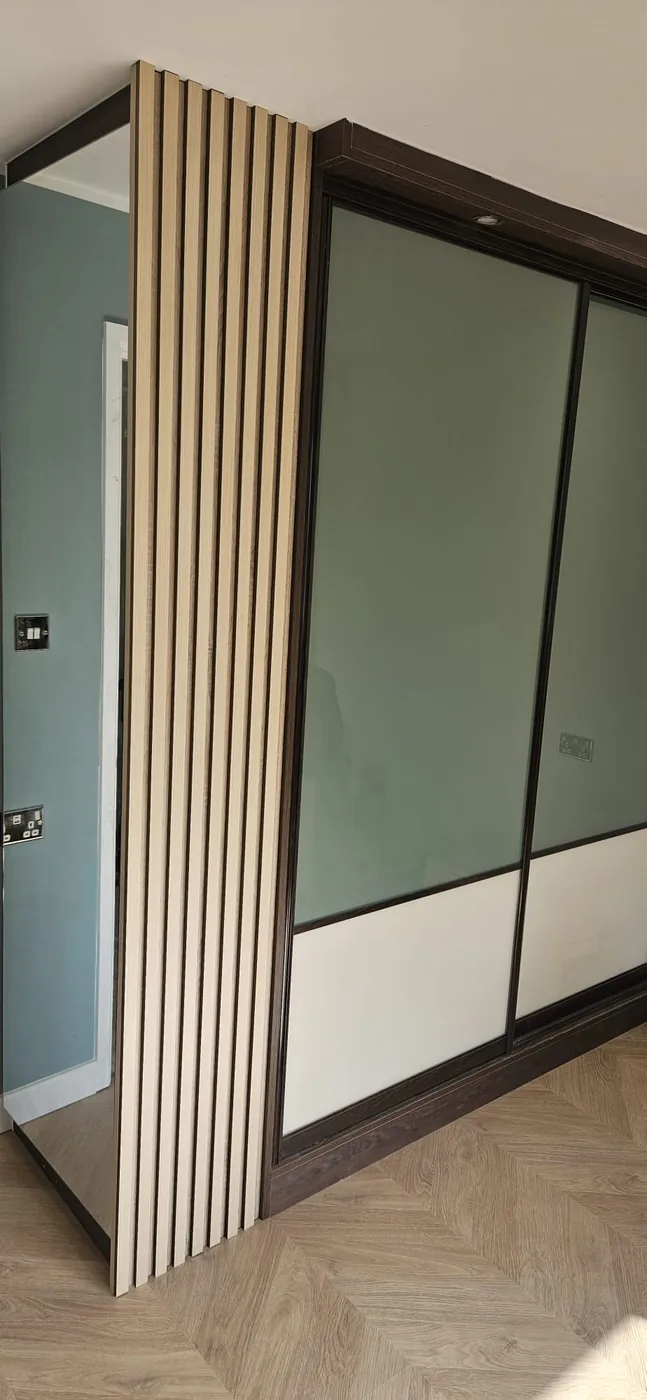 Sage green glass sliding wardrobe · close view
